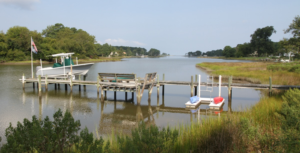 A traditional wood dock that goes against canoeing tips for safety.